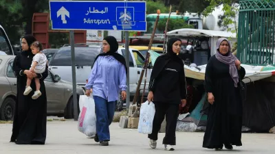 Women walk on a street as people make their way while fleeing the southern suburbs of Beirut, after Israeli Prime Minister Benjamin Netanyahu ordered the military to attack targets in the suburbs, Lebanon, June 1, 2026. REUTERS/Mohamed Azakir