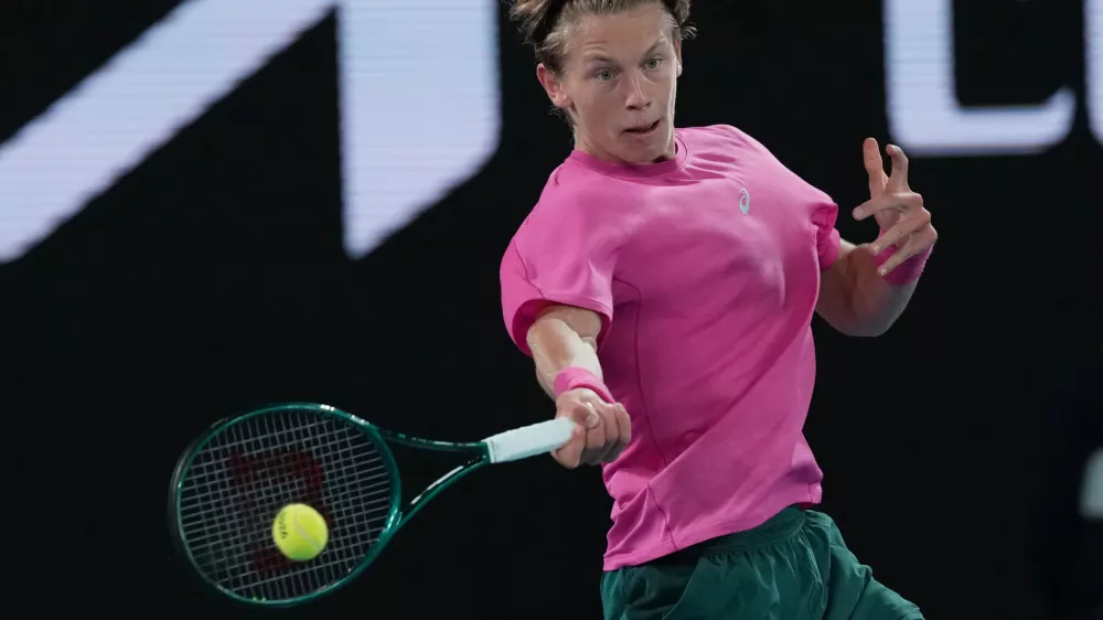 Ziga Sesko of Slovenia plays a forehand return to Keaton Hance of the U.S. during the boy's singles final at the Australian Open tennis championship in Melbourne, Australia, Sunday, Feb. 1, 2026. (AP Photo/Dar Yasin)