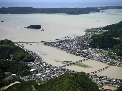 Swollen Koza River, following heavy rainfall brought by Typhoon Jangmi, in Kushimoto, Wakayama Prefecture, Japan June 3, 2026, in this photo taken by Kyodo. Mandatory credit Kyodo/via REUTERS ATTENTION EDITORS - THIS IMAGE WAS PROVIDED BY A THIRD PARTY. EDITORIAL USE ONLY. MANDATORY CREDIT. JAPAN OUT. NO COMMERCIAL OR EDITORIAL SALES IN JAPAN.