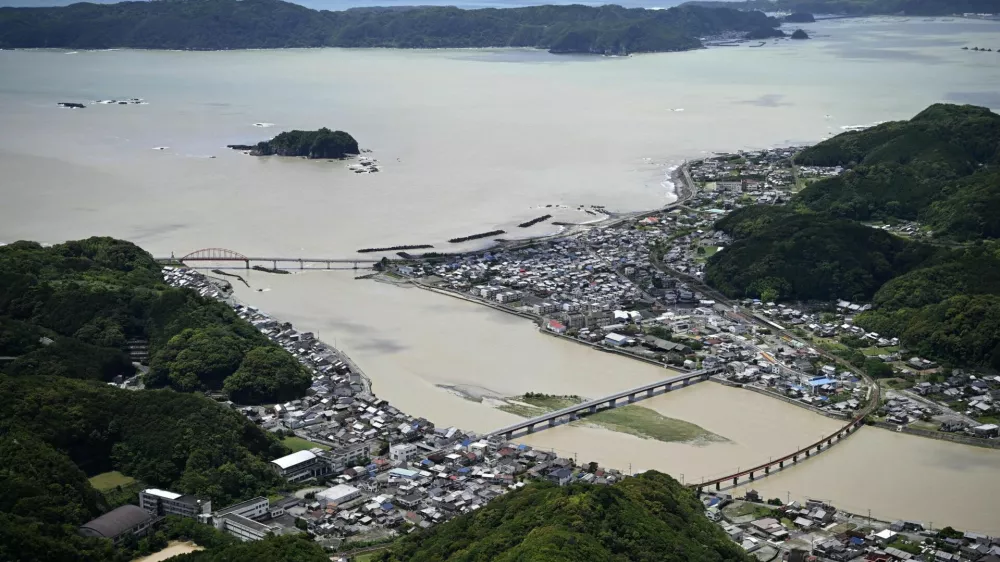 Swollen Koza River, following heavy rainfall brought by Typhoon Jangmi, in Kushimoto, Wakayama Prefecture, Japan June 3, 2026, in this photo taken by Kyodo. Mandatory credit Kyodo/via REUTERS ATTENTION EDITORS - THIS IMAGE WAS PROVIDED BY A THIRD PARTY. EDITORIAL USE ONLY. MANDATORY CREDIT. JAPAN OUT. NO COMMERCIAL OR EDITORIAL SALES IN JAPAN.
