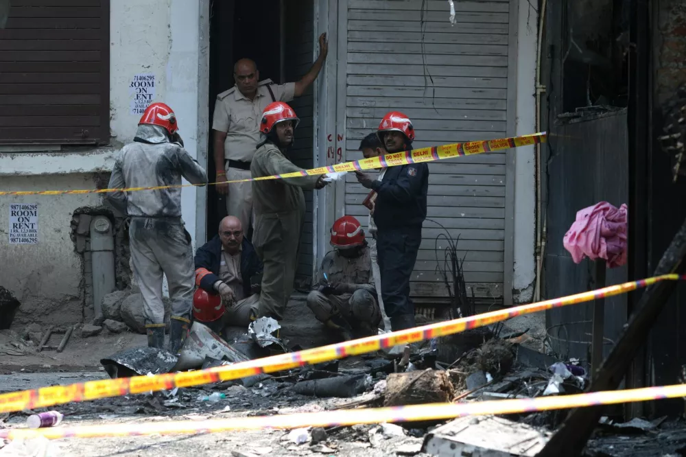 Firefighters work at the site after a fire at a hotel in New Delhi, India, June 3, 2026. REUTERS/Adnan Abidi