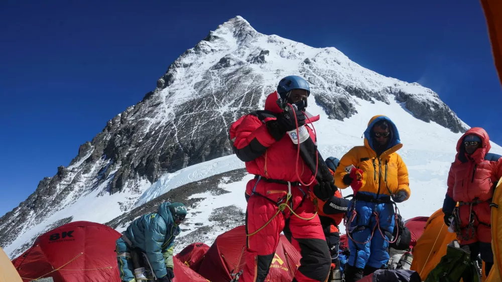 Mount Everest on the backdrop as members of an expedition team prepare to ascend the mountain, at Camp 4 in the Solukhumbu district, also known as the Everest region, Nepal, May 21, 2026. REUTERS/Purnima Shrestha