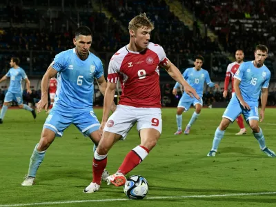 Soccer Football - Euro 2024 Qualifier - Group H - San Marino v Denmark - San Marino Stadium, Serravalle, San Marino - October 17, 2023 Denmark's Rasmus Hojlund in action with San Marino's Dante Rossi REUTERS/Jennifer Lorenzini - UP1EJAH1HMU8X