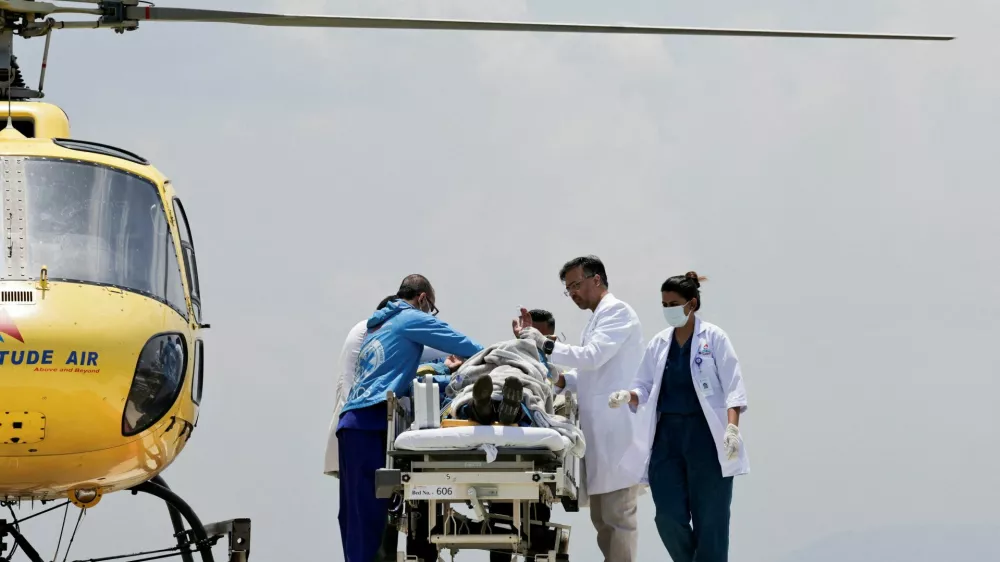 Paramedics work to transport Dawa Sherpa, who was missing for several days in the Everest region, from the helipad at HAMS Hospital in Kathmandu, Nepal, June 4, 2026. REUTERS/Navesh Chitrakar