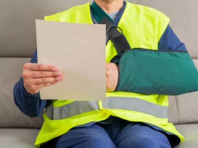 Reading letter about injury and repairman compensation paperwork, insurance, legal contract or lawyer consulting.People,attorney or advocate in negotiation, policy advice or accident report closeup