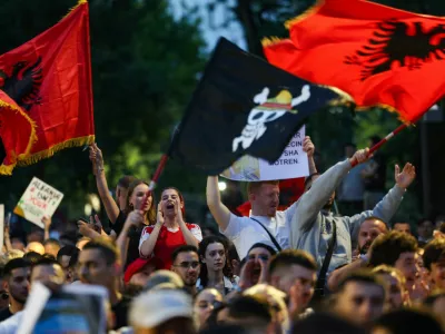 Protesters wave Albanian national flags during a protest against a luxury resort development planned by a company linked with Donald Trump's son-in-law, Jared Kushner, on an environmentally sensitive part of the Adriatic coast, in Tirana, Albania, June 4, 2026. REUTERS/Florion Goga