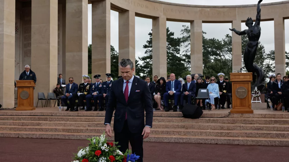 U.S. Defense Secretary Pete Hegseth lays a wreath of flowers during a ceremony at the US cemetery to commemorate the 82nd anniversary of the D-Day landings, in Colleville-sur-Mer, Normandy, France, Saturday, June 6, 2026. (AP Photo/Jeremias Gonzalez)