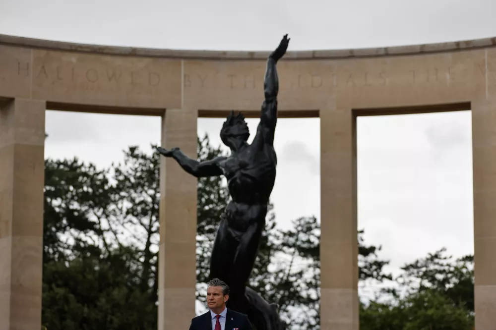 U.S. Defense Secretary Pete Hegseth delivers a speech at the US cemetery to commemorate the 82nd anniversary of the D-Day landings, in Colleville-sur-Mer, Normandy, France, Saturday, June 6, 2026. (AP Photo/Jeremias Gonzalez)