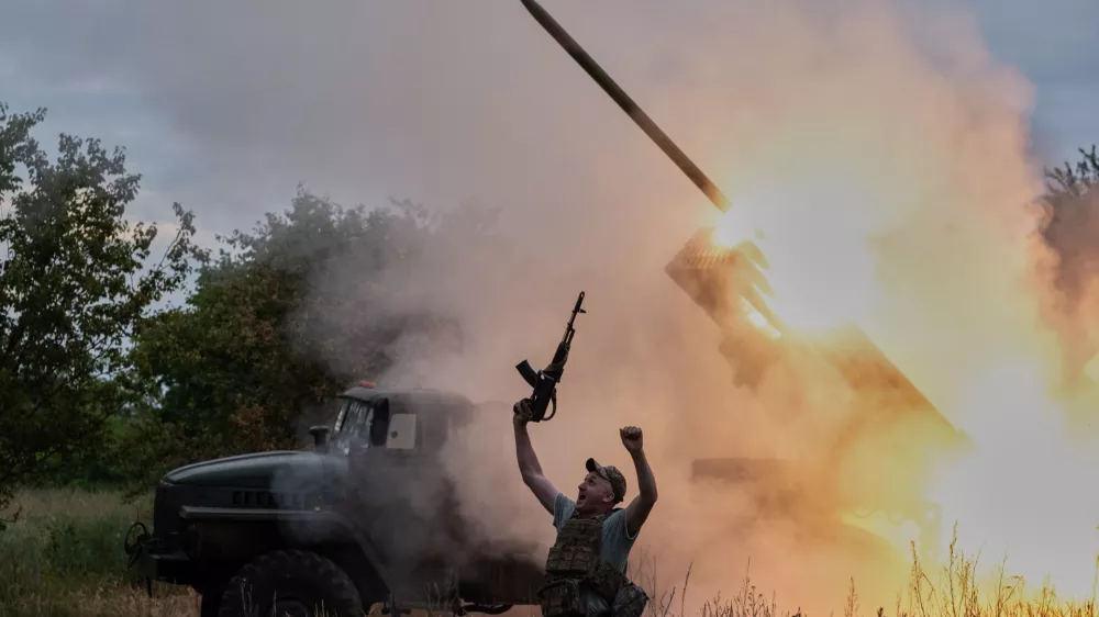 In this photo provided by Ukraine's 93rd Kholodnyi Yar Separate Mechanized Brigade press service, a soldier reacts as an MRLS BM-21 "Grad" fires at the Russian positions near Kostiantynivka, Donetsk region, Ukraine, Thursday, June 4, 2026. (Iryna Rybakova/Ukraine's 93rd Mechanized Brigade via AP)