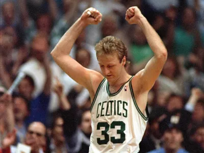 Larry Bird of the Boston Celtics raises his arms in victory at the end of Boston's 108-107 win over the Detroit Pistons in the fifth game of their NBA playoff series at the Boston Garden, Ma., Tuesday night, May 26, 1987. (AP Photo/Peter Southwick)