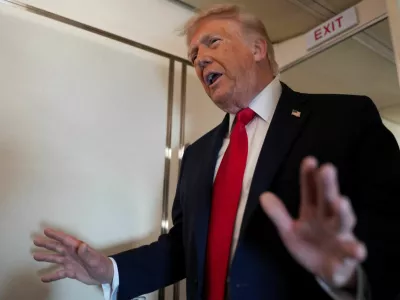 U.S. President Donald Trump speaks to members of the media on board Air Force One while flying from Joint Base Andrews to Chippewa Valley Regional Airport in Eau Claire, Wisconsin, U.S., June 5, 2026. REUTERS/Nathan Howard