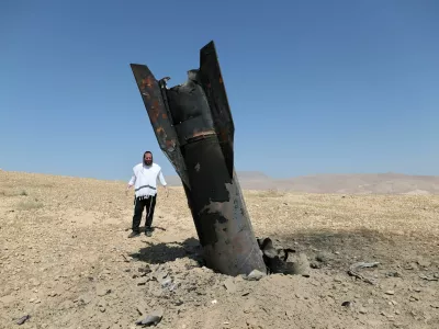 An Israeli ultra-Orthodox Jewish man reacts near a part of a missile protruding from the ground, following strikes from Iran, in the central Israeli-occupied West Bank, June 8, 2026. REUTERS/Ammar Awad