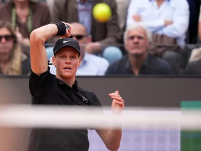 Italy's Jannik Sinner returns the ball to Andrey Rublev, during their match at the Italian Open tennis tournament in Rome, Thursday, May 14, 2026. (AP Photo/Andrew Medichini)
