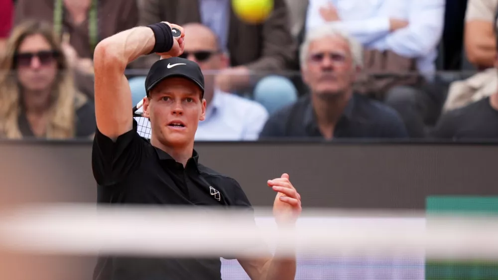 Italy's Jannik Sinner returns the ball to Andrey Rublev, during their match at the Italian Open tennis tournament in Rome, Thursday, May 14, 2026. (AP Photo/Andrew Medichini)