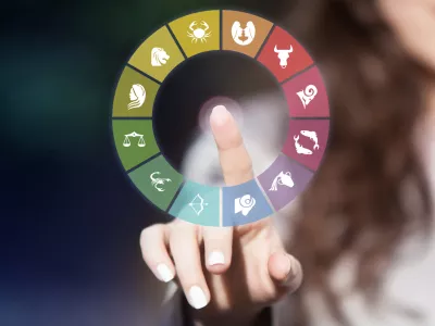 Zodiac signs on touch screen. Woman choosing horoscope symbols.