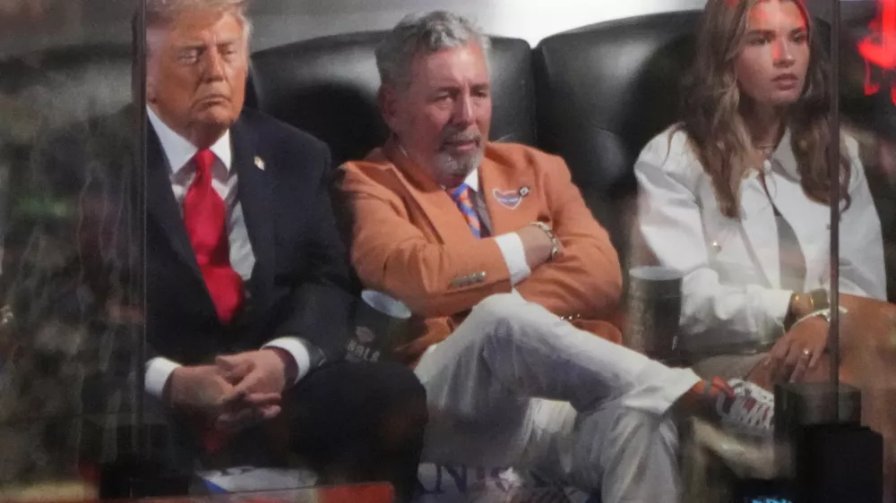 President Donald Trump watches Game 3 of the NBA Finals basketball series between the New York Knicks and the San Antonio Spurs at Madison Square Garden in New York, Monday, June 8, 2026, with Knicks owner James Dolan and Kai Trump. (AP Photo/Mark Schiefelbein)