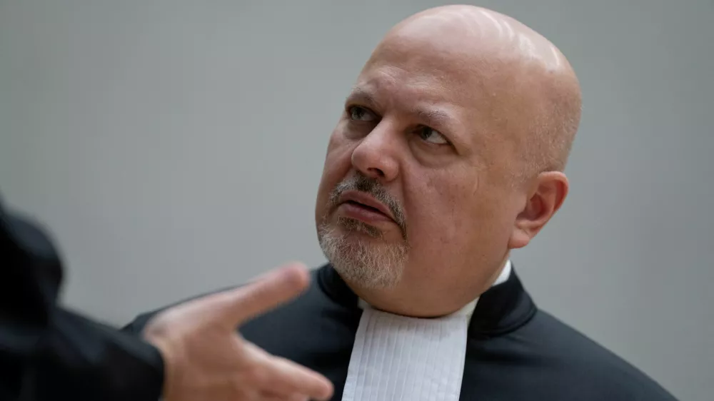 FILE PHOTO: Chief Prosecutor Karim Khan talks while waiting for former Philippine President Rodrigo Duterte to appear via video link before the International Criminal Court (ICC), in The Hague, Netherlands, Friday, March 14, 2025.   Peter Dejong/Pool via REUTERS/File Photo