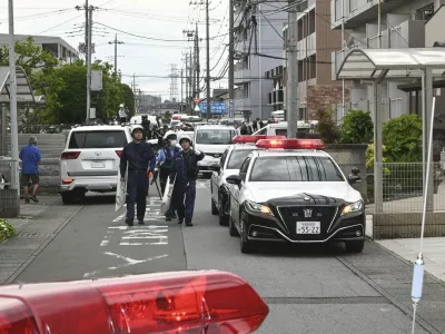 Police are seen at a residential area where a bear showed up in Utsunomiya, north of Tokyo Tuesday, June 9, 2026. (Kyodo News via AP)