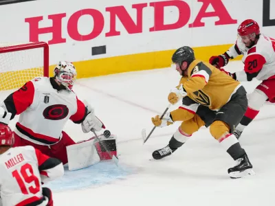 Jun 9, 2026; Las Vegas, Nevada, USA; Carolina Hurricanes goaltender Brandon Bussi (32) stops a shot by Vegas Golden Knights center Jack Eichel (9) during the 3rd period in game four of the 2026 Stanley Cup Final at T-Mobile Arena. Mandatory Credit: Stephen R. Sylvanie-Imagn Images