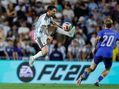 Argentina forward Lionel Messi (10) gets control of the ball as Iceland midfielder Kristian Hlynsson (20) defends during the second half of an international friendly match, Tuesday, June 9, 2026, in Auburn, Ala. (AP Photo/Butch Dill)