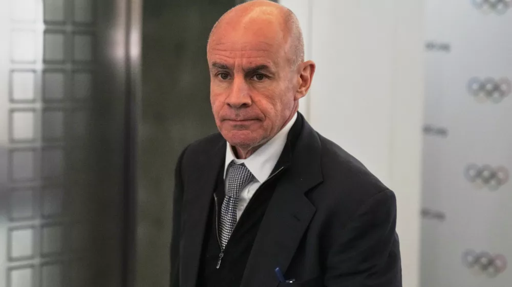 FILE - Candidate to the presidency of the International Olympic Committee Johan Eliasch arrives at the mixed zone during a break of the 144th session, which will elect the new IOC President, in Costa Navarino, western Greece, March 19, 2025. (AP Photo/Thanassis Stavrakis, File)