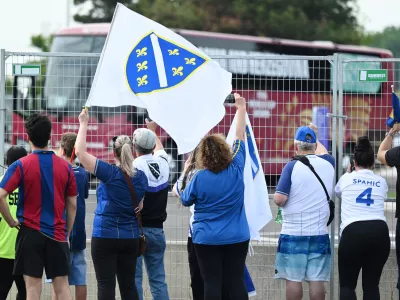 Fans look on as Bosnia and Herzegovina players arrive for a World Cup training session in Toronto, Tuesday, June 9, 2026. (Jon Blacker/The Canadian Press via AP)
