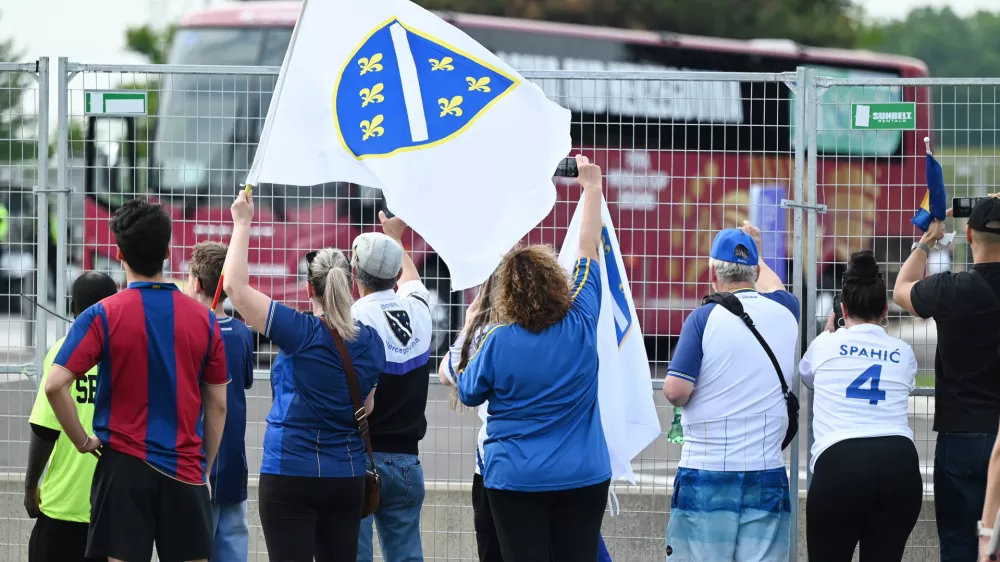 Fans look on as Bosnia and Herzegovina players arrive for a World Cup training session in Toronto, Tuesday, June 9, 2026. (Jon Blacker/The Canadian Press via AP)