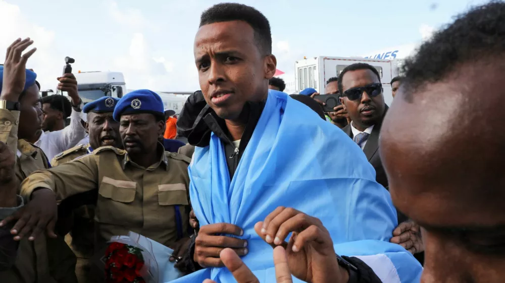 Somali referee Omar Abdulkadir Artan, who had been expected to officiate at matches during the 2026 FIFA World Cup but was denied entry to the United States, is received as he arrives at the Aden Abdulle Osman International Airport in Mogadishu, Somalia June 10, 2026. REUTERS/Feisal Omar