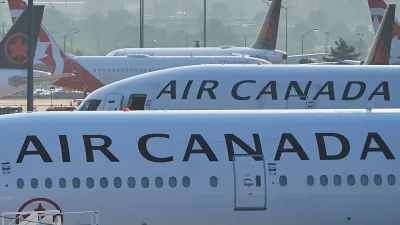 FILE - Air Canada planes sit on the runway at Pearson International Airport in Toronto on Aug. 16, 2025. (Sammy Kogan/The Canadian Press via AP, File)