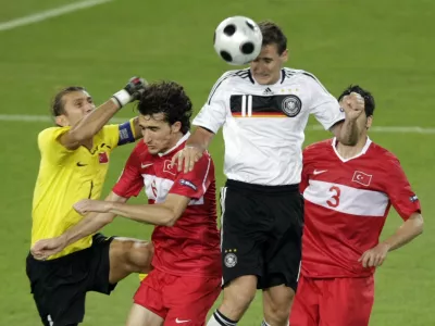 Germany's Miroslav Klose, second right, scores his team's second goal during the semifinal match between Germany and Turkey in Basel, Switzerland, Wednesday, June 25, 2008, at the Euro 2008 European Soccer Championships in Austria and Switzerland. (AP Photo/Niklas Larsson)