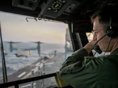 A naval officer aboard USS Tripoli (LHA 7) oversees flight operations from the control tower as the amphibious assault ship sails in the Arabian Sea. U.S. warships and aircraft deployed to the Middle East are enforcing the naval blockade against Iran while executing Project Freedom to support the free flow of commerce through the Strait of Hormuz, in this handout photo released on May 5, 2026. U.S. Navy/Handout via REUTERS  THIS IMAGE HAS BEEN SUPPLIED BY A THIRD PARTY