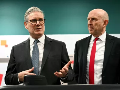 FILE PHOTO: Britain's Prime Minister Keir Starmer and Britain's Defence Secretary John Healey meet with BAE system apprentices during a joint visit in Barrow-in-Furness, Britain, on March 20, 2025.   OLI SCARFF/Pool via REUTERS/File Photo