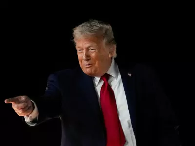 FILE PHOTO: U.S. President Donald Trump reacts as he boards Air Force One, after attending Game 3 of the NBA Finals, at John F. Kennedy International Airport in New York, U.S., June 8, 2026. REUTERS/Nathan Howard/File Photo