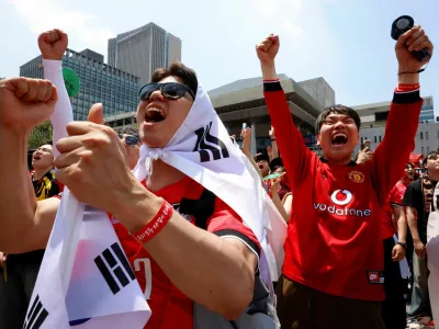 Fans cheer as they watch South Korea play the Czech Republic during their FIFA World Cup 2026 Group A match, at a public viewing event in Seoul, South Korea, June 12, 2026. REUTERS/Kim Soo-hyeon
