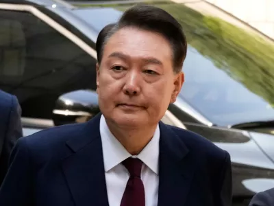 South Korea's ousted former President Yoon Suk Yeol arrives to attend his trial at the Seoul Central District Court in Seoul, South Korea, May 12, 2025. (AP Photo/Ahn Young-joon, Pool, File)