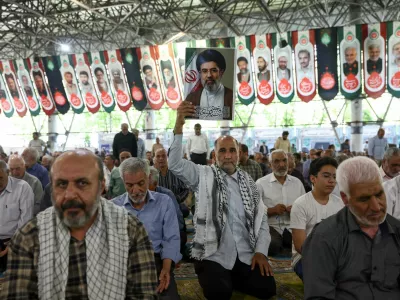 A man holds a picture of Iran's Supreme Leader, Mojtaba Khamenei, during Friday prayer in Tehran, Iran, June 12, 2026. Majid Asgaripour/WANA (West Asia News Agency) via REUTERS  ATTENTION EDITORS - THIS PICTURE WAS PROVIDED BY A THIRD PARTY. ISRAEL OUT. NO COMMERCIAL OR EDITORIAL SALES IN ISRAEL. NO ACCESS FOR ISRAELI MEDIA. NO USE BBC PERSIAN. NO USE VOA PERSIAN. NO USE MANOTO. NO USE IRAN INTERNATIONAL. NO USE RADIO FARDA. DIGITAL: NO USE BBC PERSIAN. NO USE VOA PERSIAN. NO USE MANOTO. NO USE IRAN INTERNATIONAL. NO USE RADIO FARDA.
