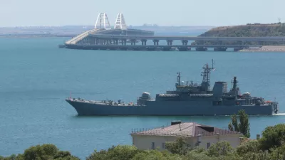 FILE - A Russian military ship transports cars and people from&nbsp;the Russian mainland to&nbsp;the Crimean Peninsula over the Kerch Strait on Monday, July 17, 2023. (AP Photo, File)