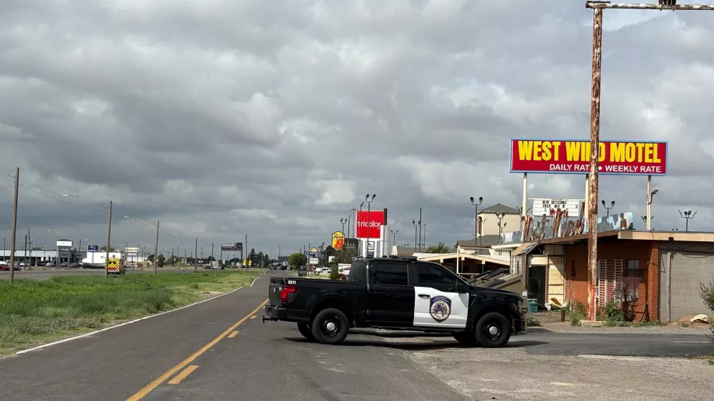 Law enforcement responds to an active shooting scene Friday, June 12, 2026, in Midland, Texas. (Luke Dias/Reporter-Telegram via AP)