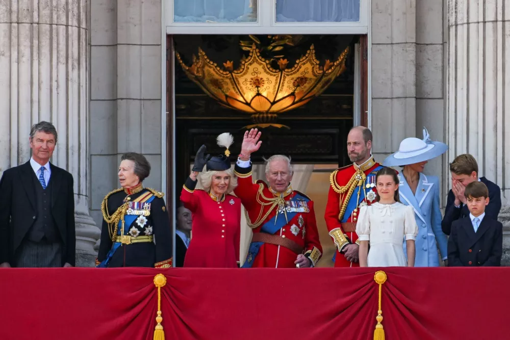 Britain's King Charles, Queen Camilla, Prince William, Kate, Princess of Wales, Prince George, Princess Charlotte, Prince Louis, Anne, Princess Royal, and other officials appear on the balcony of Buckingham Palace during the Trooping the Colour parade to honour Britain's King Charles, as part of the official birthday celebrations, in London, Britain, June 13, 2026. REUTERS/Chris J. Ratcliffe
