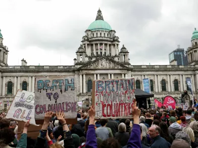 Demonstrators take part in a 'United Against Racism' rally after days of anti-immigration violence, following a knife attack on June 8, which left a man seriously injured and prompted police to declare a critical incident, outside the Belfast City Hall, in Belfast, Northern Ireland, June 13, 2026. REUTERS/Isabel Infantes