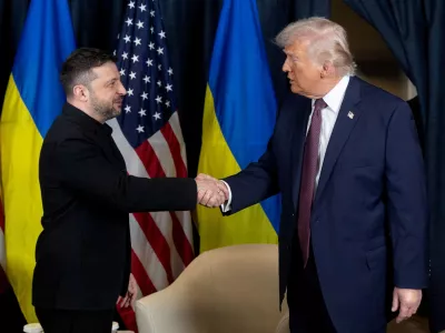 FILE PHOTO: Ukrainian President Volodymyr Zelenskiy and U.S. President Donald Trump shake hands during their meeting at the sidelines of the 56th annual World Economic Forum (WEF), in Davos, Switzerland, January 22, 2026. Ukrainian Presidential Press Service/Handout via REUTERS ATTENTION EDITORS - THIS IMAGE HAS BEEN SUPPLIED BY A THIRD PARTY./File Photo