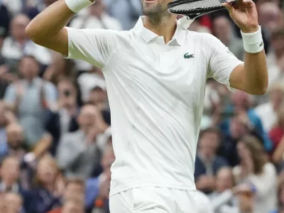 Novak Djokovic of Serbia reacts after defeating Alexei Popyrin of Australia in their third round match at the Wimbledon tennis championships in London, Saturday, July 6, 2024. (AP Photo/Kirsty Wigglesworth)