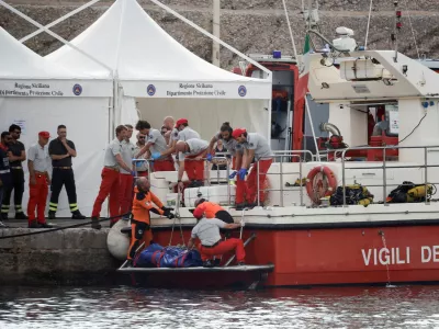FILE PHOTO: Rescue personnel work next to the body bag containing the corpse of British entrepreneur Mike Lynch, who died when a yacht owned by his family sank off the coast of Porticello, near the Sicilian city of Palermo, Italy, August 22, 2024. REUTERS/Louiza Vradi/File Photo