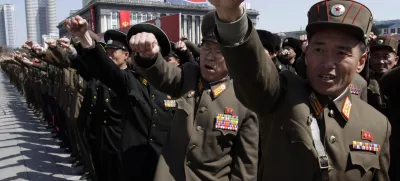 North Korean army officers punch the air as they chant slogans during a rally at Kim Il Sung Square in downtown Pyongyang, North Korea, Friday, March 29, 2013. Tens of thousands of North Koreans turned out for the mass rally at the main square in Pyongyang in support of their leader Kim Jong Un's call to arms. (AP Photo/Jon Chol Jin)