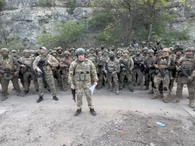 Founder of Wagner private mercenary group Yevgeny Prigozhin makes a statement as he stand next to Wagner fighters in an undisclosed location in the course of Russia-Ukraine conflict, in this still image taken from video released May 5, 2023. Press service of "Concord"/Handout via REUTERS ATTENTION EDITORS - THIS IMAGE WAS PROVIDED BY A THIRD PARTY. NO RESALES. NO ARCHIVES. MANDATORY CREDIT.